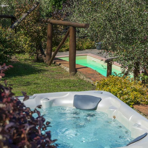 Sink into the outdoor hot tub and relax