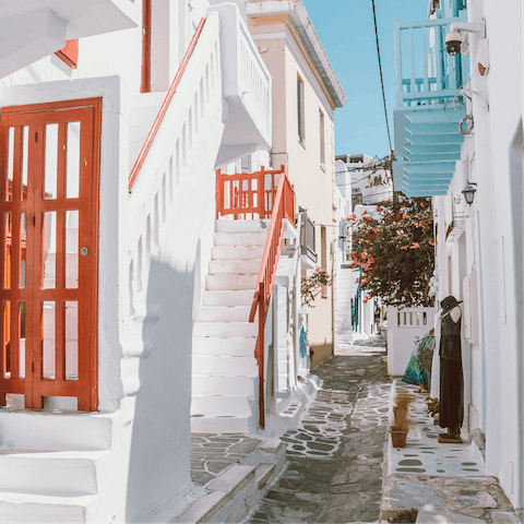 Walk the cobbled streets in Mykonos Town – a seventeen-minute drive away