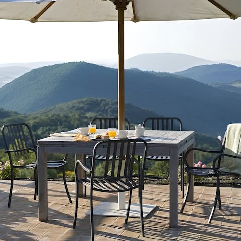 Tuck into a traditional Umbrian supper as dusk falls over the hills