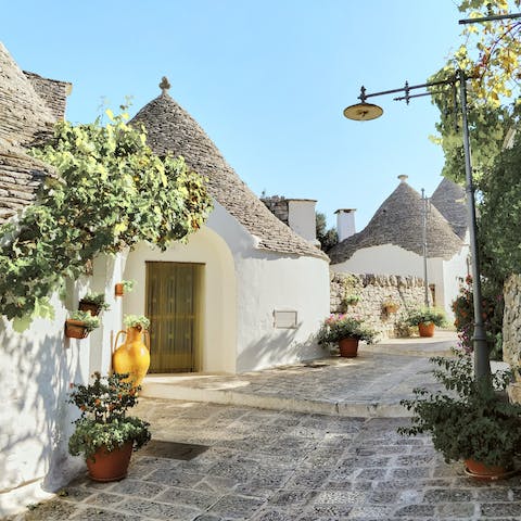 Marvel at the charming trulli of Alberobello, a fifteen-minute drive away
