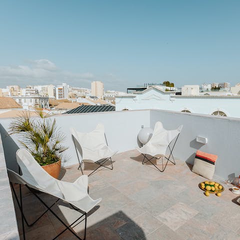 Make the most of the sunshine with a trip up to the shared rooftop terrace