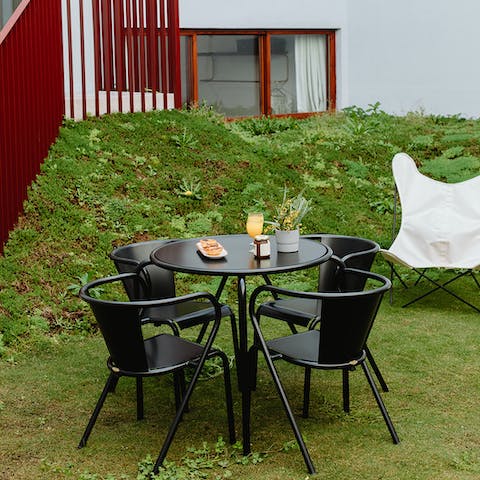 Enjoy a bite in the shared mossy garden before setting off to explore