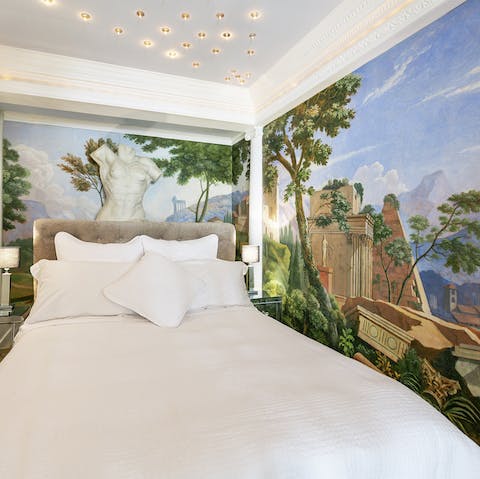 Drift off to sleep surrounded by the gorgeous ancient Greece inspired murals covering the walls