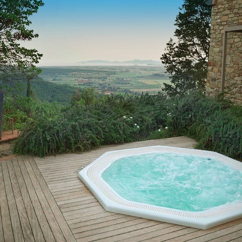 Feel yourself relax in the bubbling hot tub and enjoy the views