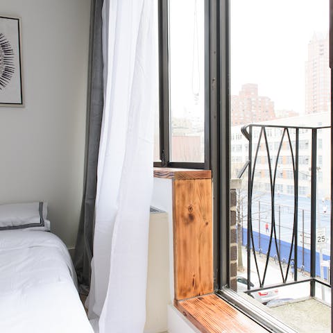 Step from the bedroom onto the balcony and take in the sights of this Upper East Side neighbourhood