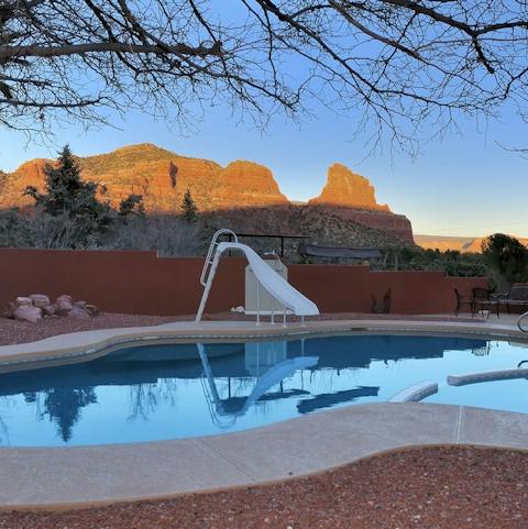 Slide into the pool surrounded by the desert