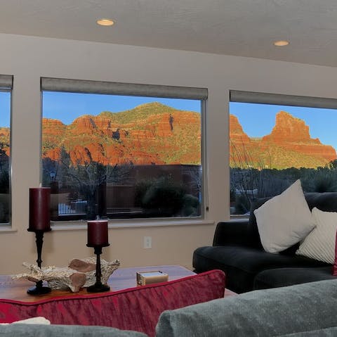 Watch the sunset over Red Rock from room to room