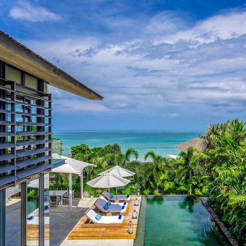 Take in turquoise views of the sparkling seascape over Natai Beach