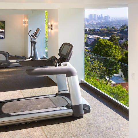 Work out in the gym overlooking panoramic views of the city 