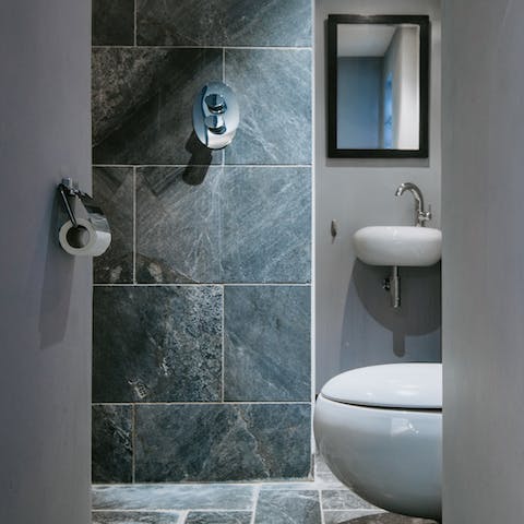 The sleek tiled bathroom