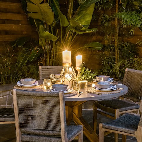 Entertain your loved ones with an alfresco candle-lit dinner