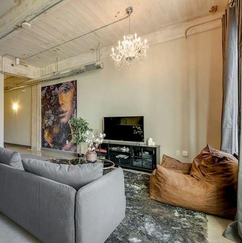 Chill out with a glass of wine in the industrial-chic living room