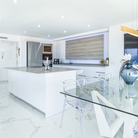 Cook up a feast in the sleek, marble-clad kitchen
