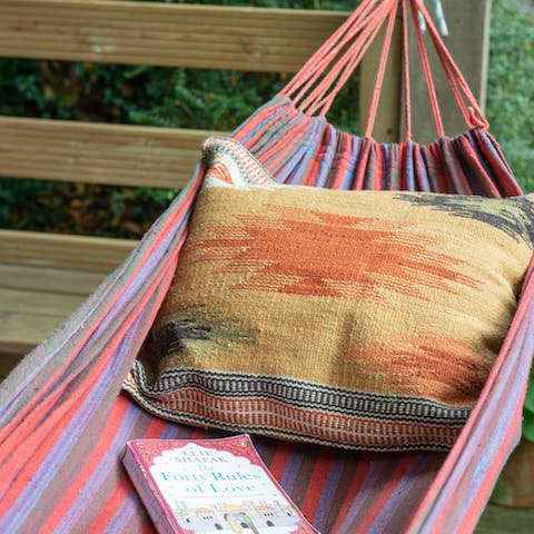 Pick a book from the library and lounge in the hammock as you read
