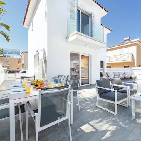 Lay out a breakfast spread on the outdoor dining table to enjoy alfresco