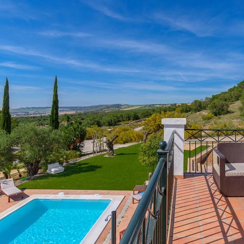 Wake up to far-reaching views from the main bedroom balcony