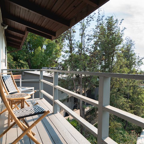 Enjoy your morning coffee out on the balcony with views overs the trees