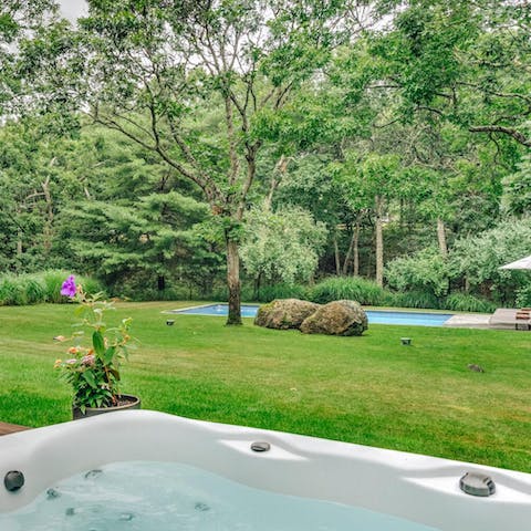 Soak in the hot tub with a view of the gardens