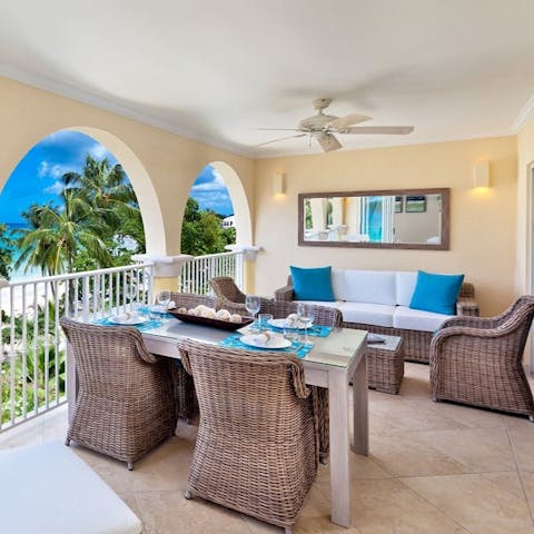 Gaze at the beach and ocean views from the lounge and dining areas on your balcony