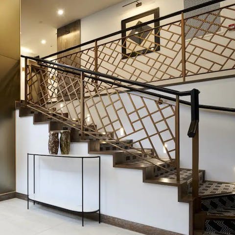 Ascend the stylish communal staircase on your way home