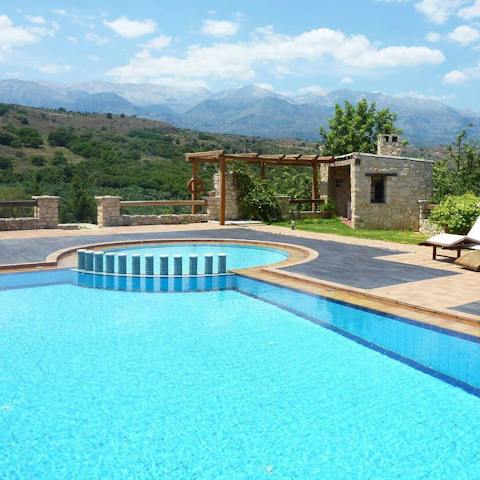 Cool off in the turquoise pool with stunning mountain views
