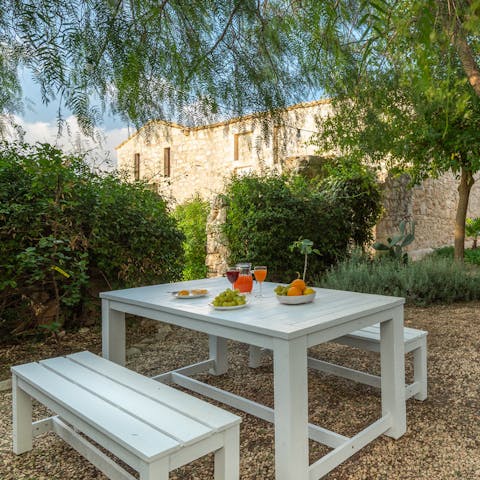 Dine alfresco in the shade of ancient trees