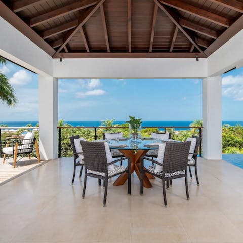 Dine alfresco with a view of the Caribbean