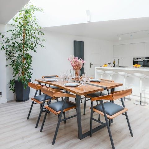 Share a meal at the chic wooden dining table