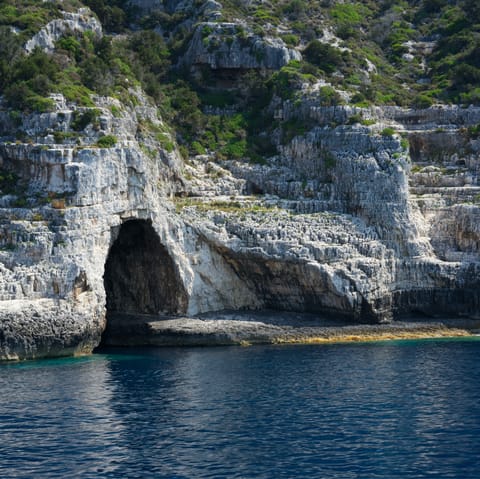 Discover some of the many caves dotted along the Paxi coastline