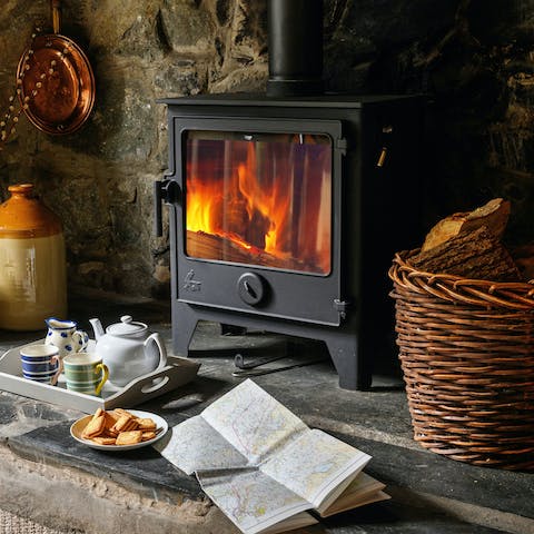 Get cosy around the roaring log burner in the inglenook fireplace