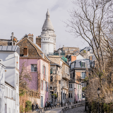 Take a fifteen-minute walk over to explore the picture-perfect streets of Montmartre 