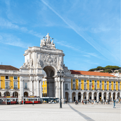 Make the quarter of an hour walk over to the grand Praça do Comércio