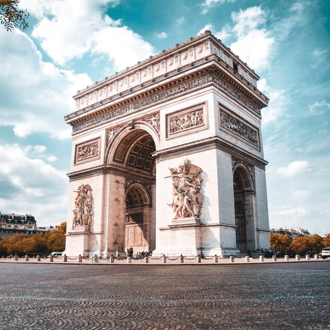 Stretch your legs with a wander over to the unmistakable Arc de Triomphe
