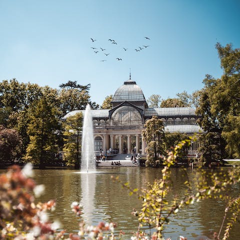 Take an afternoon stroll through El Retiro Park, twelve minutes away on foot