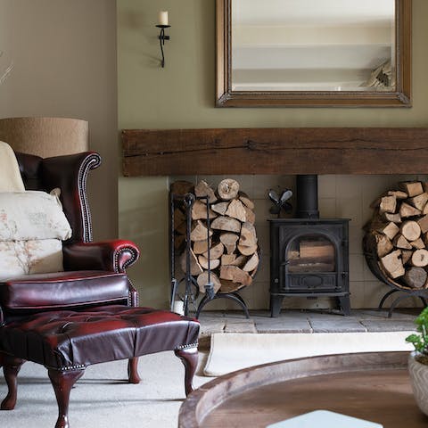 Light up the wood-burning fireplace in the living room and get cosy