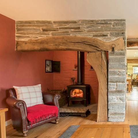 Cosy up by the wood burning fireplace, after a country walk 