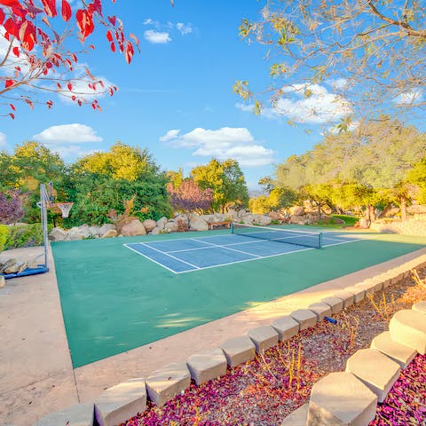 Start the day with a few sets of tennis on the private court