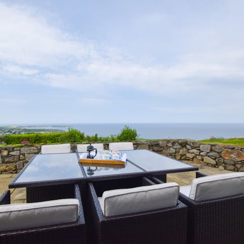 Dine alfresco and enjoy stunning sea views, Porthdinllaen beach, Nefyn's headland golf course, the boats in the harbour and Anglesey beyond