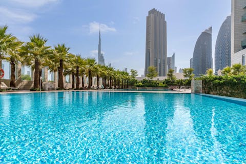 Swim in the sparkling communal pool to cool off in the Dubai heat
