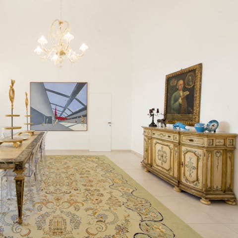 Soak in the blend of contemporary and neoclassical art and decor
