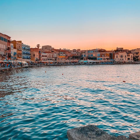 Sip a glass of Cretan wine by the water's edge of Chania's Venetian harbour