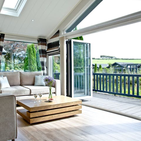 Slide open the bi-fold doors and let the outside in
