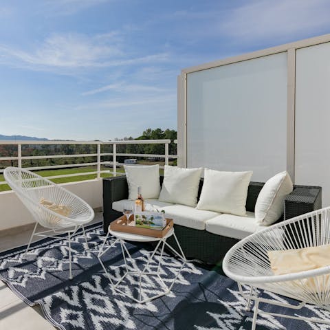 Sip wine on the rooftop terrace, with views over the mountains
