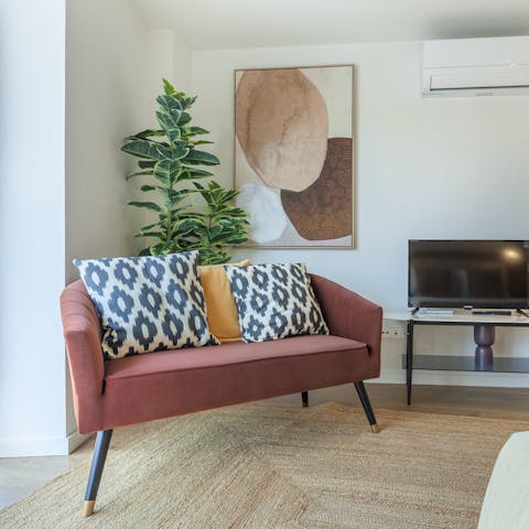 Unwind with your favourite show in the light-filled living area