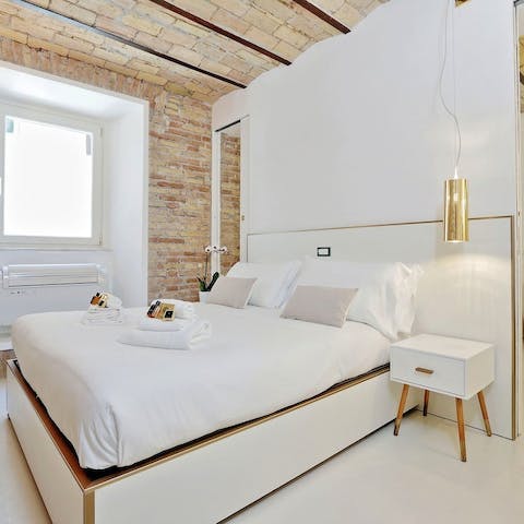 Sleep soundly in the calm, white bedroom