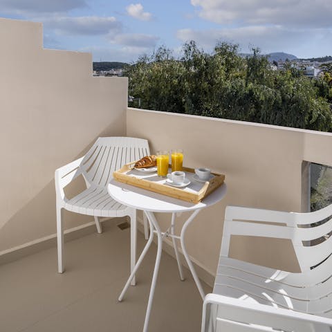 Start your day with a morning coffee and a pastry on the sunny balcony