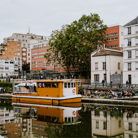 Walk along Canal Saint-Martin and explore its shops, bakeries and restaurants – a seven-minute stroll away