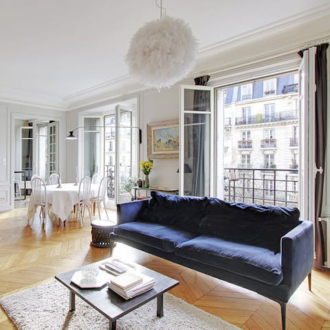 Throw open the French windows in the living room and admire the typically Parisian scene outside