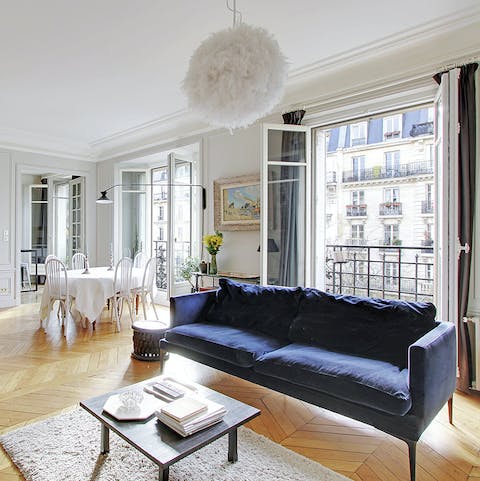 Throw open the French windows in the living room and admire the typically Parisian scene outside