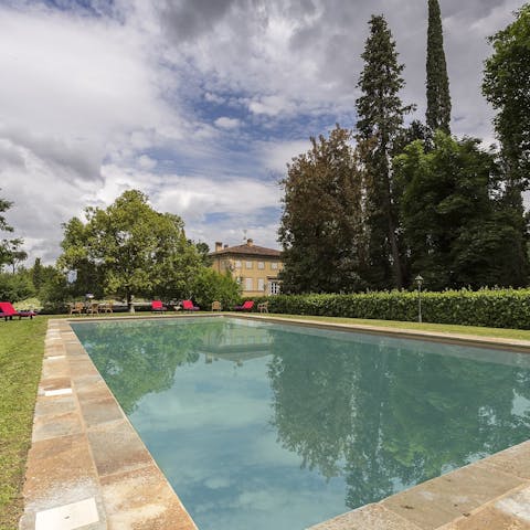 Slip into the pristine swimming pool and swim some laps